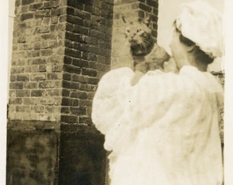 snapshot 1915 Woman Holds Cat Over her Back Shoulder on Roof Brick Chimney