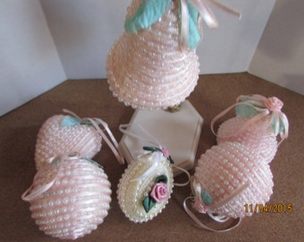 six vintage hand made ornaments Pink and one white