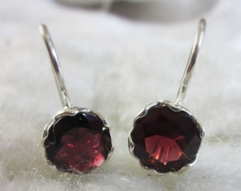 Incredible 2.5 ct. Garnet Earrings hooked on a Silver Caged Setting
