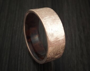 14k rose gold band with distressed finish and desert ironwood burl wood sleeve custom made
