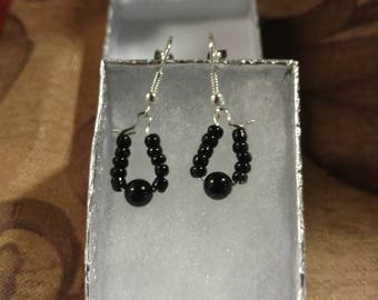 Hoop earrings with tiny black beads