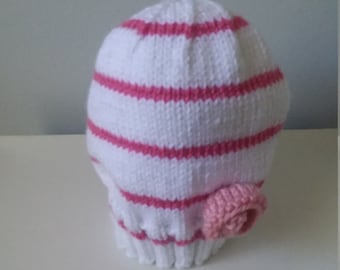 White and pink hat with pink flower
