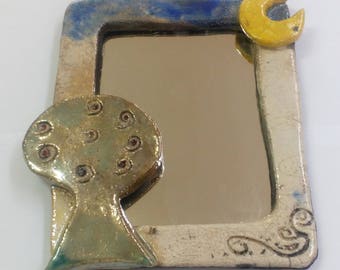 Ceramic raku mirror with tree.