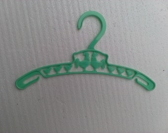 4 different colored vintage children's Plastic Hangers