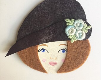 Brooch with plum leather Hat woman face