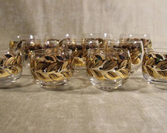Set of 11 mid century gold black wreath roly poly's