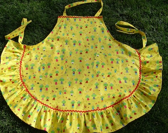 Bright yellow apron with frogs.