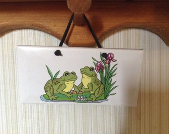 Ceramic Plaque it is 3 by 6 With frogs