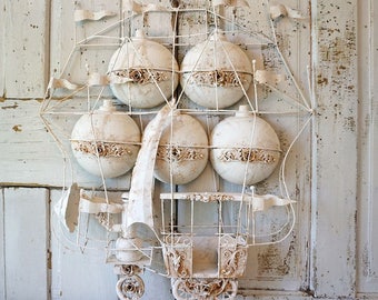 Hot air balloon flying machine metal sculpture wall decor white distressed ornately large art piece decoration anita spero design