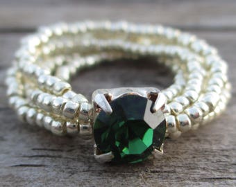 Beaded multi-strand silver ring with green focal bead