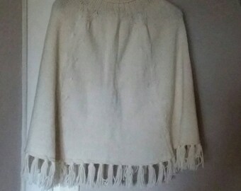 off-white poncho with fringe woman