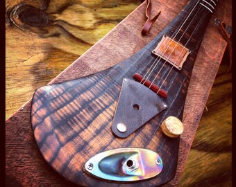 Handcrafted electric guitar by DaShtick guitars. 4 string Celtic diddley bow. CBG
