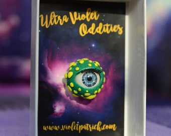 Green and Yellow blinking Eyeball Pin