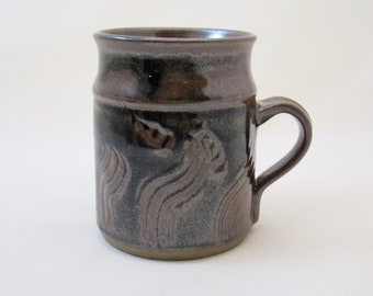 Stoneware temmoku mugs, wheel-thrown and hand-carved