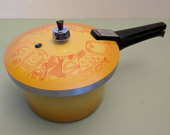 Presto Deluxe Pressure Cooker Model 409A, Harvest Yellow with smiling pigs and cows, chickens and ducks