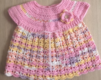 Baby dress with ribbon and flower