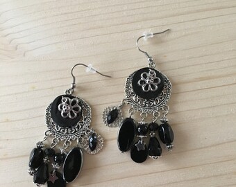 pierced black and Silver earrings