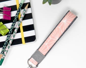 Rose quartz geometric key fob, full size wrist strap keychain, new moms handsfree key holder, trendy dusty rose key bracelet on gray linen