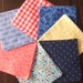 4 1/2" by 4 1/2" Red, Blue, Orange, and Yellow Cotton Print Charm Pack for Quilting, Vintage Fabrics