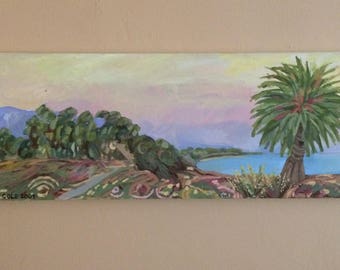 Rainbow sunset coastal palm tree
