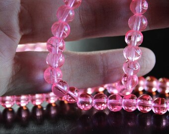 130 approx. 6 mm drawbench transparent glass beads, hot pink with spray painted white lines, hole 1.3-1.6 mm