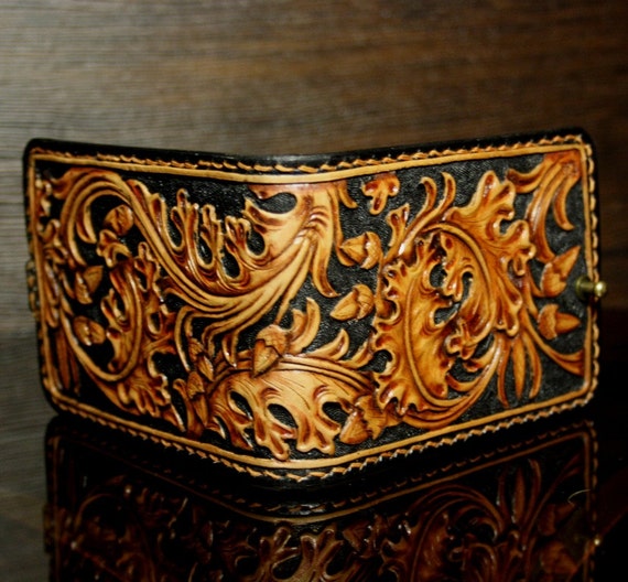 Hand-tooled leather money clip with oak leaves pattern