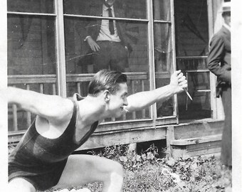 Vintage Photo "Surprise Attack" Man Wearing Swimsuit Smoking Cigarette Wields Grapefruit Knife Found Vernacular Photo