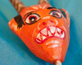 Handmade paper mache devil puppet