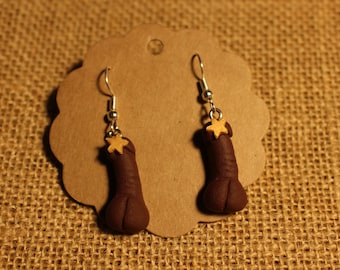 Censured black penis earrings