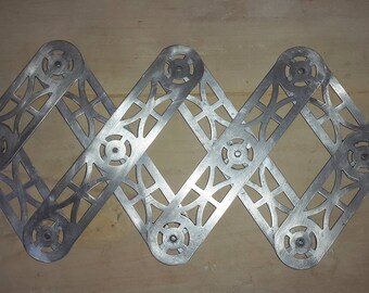 Below flat stretch accordion - expandable trivet, mat - 50's aluminum