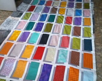 Illusion Quilt. It is machine pieced and machine quilted. I can make in the colors and size you would like. Size is a generous twin.