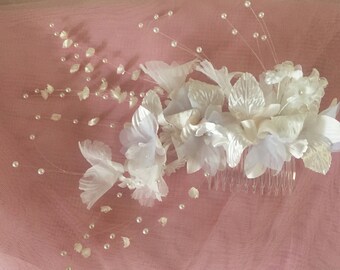 Floral spray with "shooting" delicate pearls, mounted on a hair comb