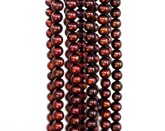 1807 Vinous pearls 6 mm Potato pearls Off round pearls Natural freshwater pearls Dark red roundish pearls Natural cultivated pearls.