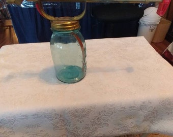 Vintage Insect Sprayer attached to an aqua colored Vintage Ball Perfect Mason Jar.