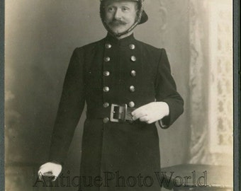 England Elland firefighter in uniform helmet antique cabinet photo