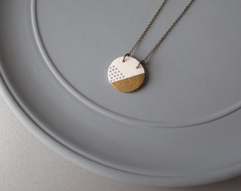 Tal - Cream and Gold Ceramic Pendant Necklace; Handmade Round Clay, Brass Metallic Stripe & Grey Dots (Sautoir Céramique Or) by InfinEight