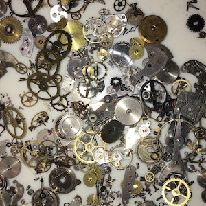 10 Grams All Steampunk watch gears and parts , For art , jewelery making etc . All parts ultrasonic cleaned and are removed by Watch Maker