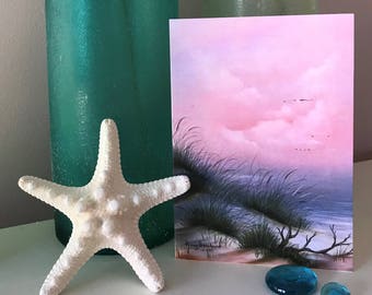 Blank greeting card of an original oil painting of a beach at dawn