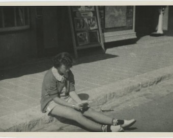 Vintage Snapshot Photo: Girl on Curb Outside Movie Theater, c1940s (75579)