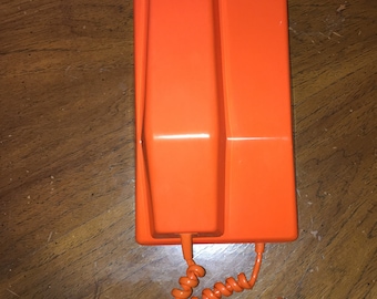 1969 Orange rotary dial phone