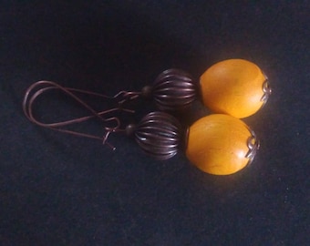 Earrings made of wood ash and copper