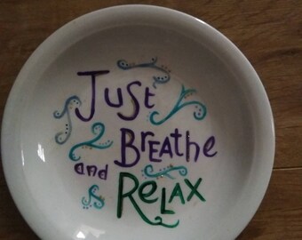 Hand painted white ceramic plate.