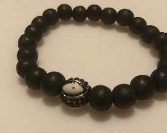 Wooden bracet with evil eye bead
