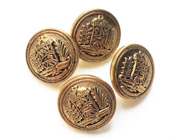 small eco friendly pristine antiqued gold tone metal shank buttons with detailed shield and frond picture design--matching lot of 4