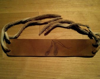 Leather wristband with feather burn drawing