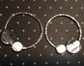 Silver hoop earrings with two asymmetrical circles