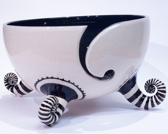 Black and white yarn bowl with stripey socks