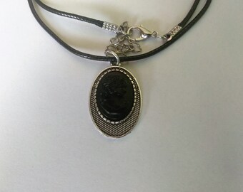 Handmade silver colored necklace with cameo made out of coal