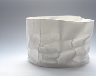 White vase. Crumpled paper looking vessel made out of English fine bone china with a hint of mother of pearl - iridescent
