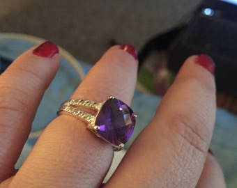 Large cut amethyst with white stone accents